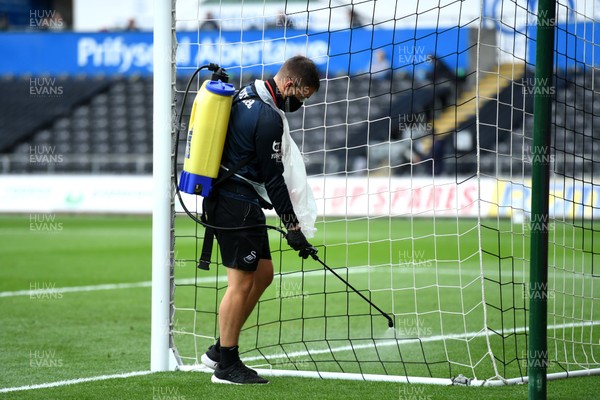 260720 - Swansea City v Brentford - EFL SkyBet Championship Play-Off - Ground staff spray the goals with anti bacteria  spray