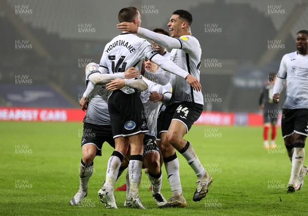 270121 - Swansea City v Brentford - SkyBet Championship - Conor Hourihane of Swansea City celebrates scoring a goal with Jake Bidwell, Ben Cabango and team mates