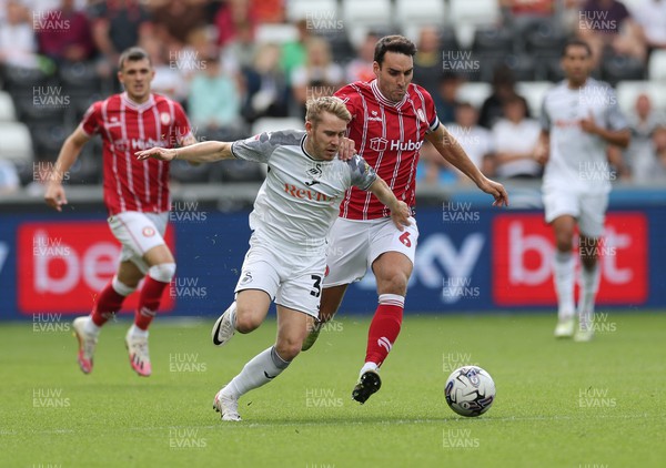 020923 - Swansea City v Bristol City, Sky Bet Championship - Ollie Cooper of Swansea City is challenged by Matthew James of Bristol City
