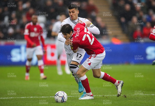 130222 - Swansea City v Bristol City, Sky Bet Championship - Joel Piroe of Swansea City and Timm Klose of Bristol City compete for the ball