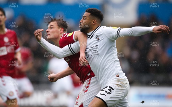 130222 - Swansea City v Bristol City, Sky Bet Championship - Cyrus Christie of Swansea City  and Cameron Pring of Bristol City compete for the ball