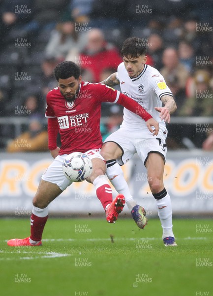 130222 - Swansea City v Bristol City, Sky Bet Championship - Jamie Paterson of Swansea City and Jay Dasilva of Bristol City compete for the ball