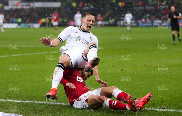 130222 - Swansea City v Bristol City, Sky Bet Championship - Hannes Wolf of Swansea City is brought down by Jay Dasilva of Bristol City