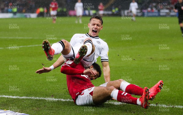130222 - Swansea City v Bristol City, Sky Bet Championship - Hannes Wolf of Swansea City is brought down by Jay Dasilva of Bristol City
