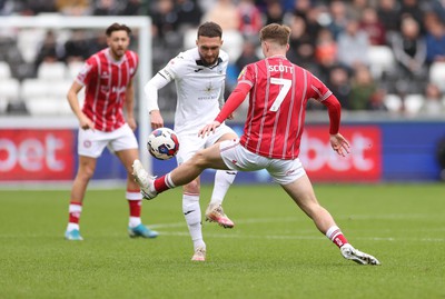 190323 - Swansea City v Bristol City, EFL Sky Bet Championship - Matt Grimes of Swansea City plays the ball past Alex Scott of Bristol City