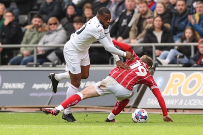 190323 - Swansea City v Bristol City, EFL Sky Bet Championship - Olivier Ntcham of Swansea City is brought down by George Tanner of Bristol City