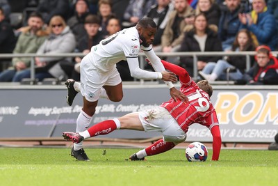 190323 - Swansea City v Bristol City, EFL Sky Bet Championship - Olivier Ntcham of Swansea City is brought down by George Tanner of Bristol City