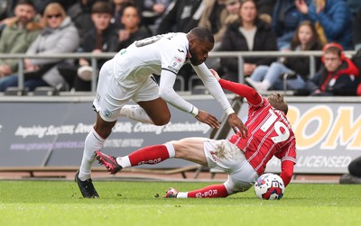 190323 - Swansea City v Bristol City, EFL Sky Bet Championship - Olivier Ntcham of Swansea City is brought down by George Tanner of Bristol City