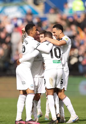 190323 - Swansea City v Bristol City, EFL Sky Bet Championship - Team mates celebrate with Olivier Ntcham of Swansea City after he scores Swansea’s second goal