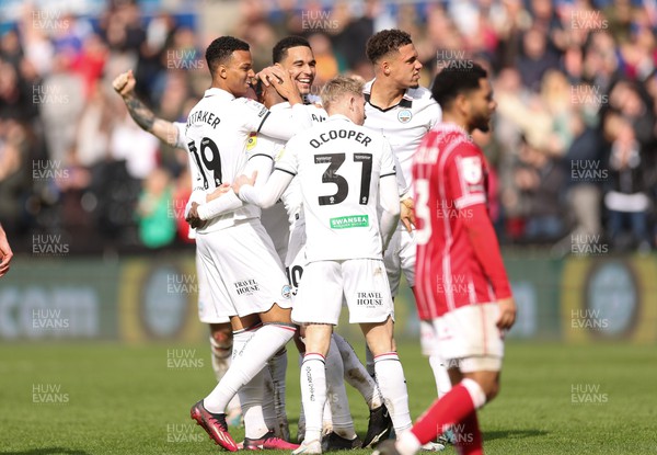 190323 - Swansea City v Bristol City, EFL Sky Bet Championship - Team mates celebrate with Olivier Ntcham of Swansea City after he scores Swansea’s second goal