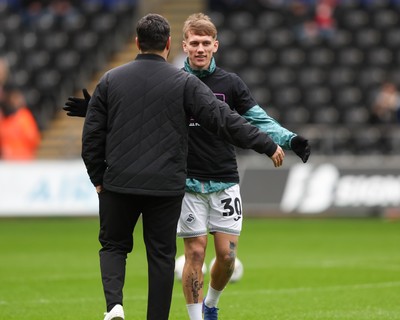 210226 - Swansea City v Bristol City - Sky Bet Championship - Vitor Matos Swansea City Manager (L) hugs Ethan Galbraith of Swansea City (R)