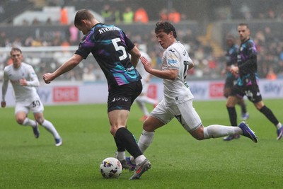 210226 - Swansea City v Bristol City - Sky Bet Championship - Goncalo Franco of Swansea City pressures Rob Atkinson of Bristol City