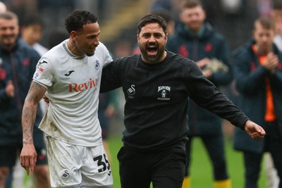 210226 - Swansea City v Bristol City - Sky Bet Championship - Ronald of Swansea City (L) and Vitor Matos Swansea City Manager (R) celebrate at full-time