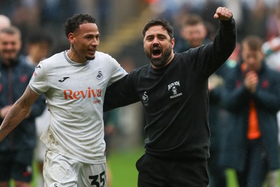 210226 - Swansea City v Bristol City - Sky Bet Championship - Ronald of Swansea City (L) and Vitor Matos Swansea City Manager (R) celebrate at full-time