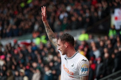210226 - Swansea City v Bristol City - Sky Bet Championship - Josh Tymon of Swansea City takes a corner 
