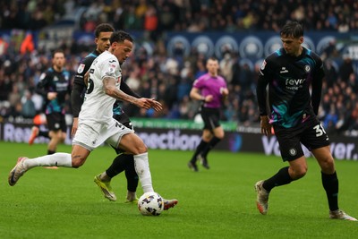 210226 - Swansea City v Bristol City - Sky Bet Championship - Ronald of Swansea City attacks with pressure from Noah Eile of Bristol City