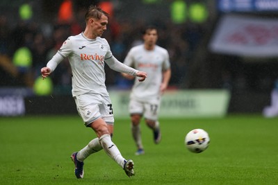 210226 - Swansea City v Bristol City - Sky Bet Championship - Ethan Galbraith of Swansea City passes the ball