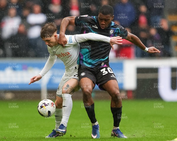 210226 - Swansea City v Bristol City - Sky Bet Championship - Ethan Galbraith of Swansea City and Sinclair Armstrong of Bristol City battle for the ball 