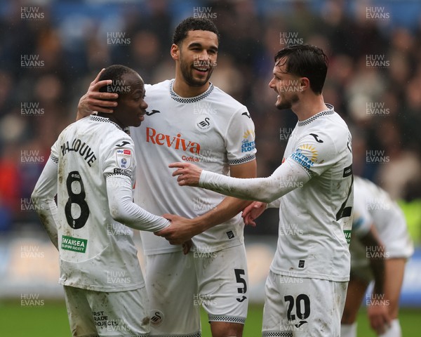 210226 - Swansea City v Bristol City - Sky Bet Championship - Malick Yalcouye (L) Ben Cabango (C) and Liam Cullen of Swansea City (R) celebrate at full-time