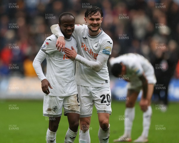 210226 - Swansea City v Bristol City - Sky Bet Championship - Malick Yalcouye (L) and Liam Cullen of Swansea City (R) celebrate at full-time