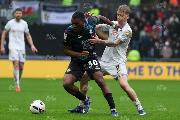 210226 - Swansea City v Bristol City - Sky Bet Championship - Melker Widell of Swansea City and Sinclair Armstrong of Bristol City battle for the ball
