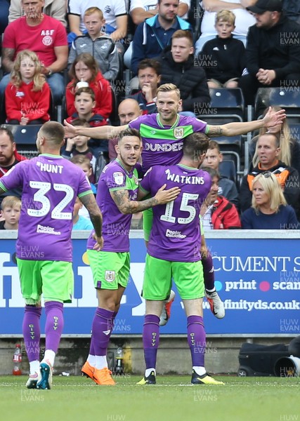 250818 - Swansea City v Bristol City, Sky Bet Championship - Andreas Weimann of Bristol City is held aloft as he celebrates with team mates after scoring goal early in the match