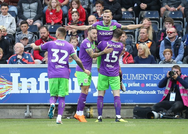 250818 - Swansea City v Bristol City, Sky Bet Championship - Andreas Weimann of Bristol City is held aloft as he celebrates with team mates after scoring goal early in the match