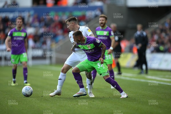 250818 - Swansea City v Bristol City, Sky Bet Championship - Jack Hunt of Bristol City and Barrie McKay of Swansea City compete for the ball