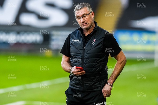 270221 - Swansea City v Bristol City - Sky Bet Championship - Nigel Pearson, Bristol City manager reacts during the game while on his mobile phone 