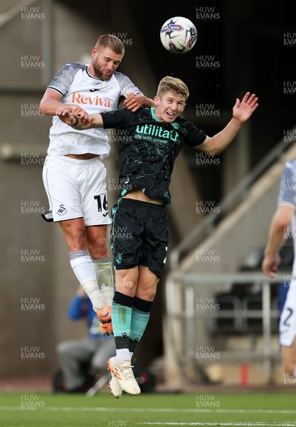 250723 - Swansea City v Bristol Rovers - Pre Season Friendly - Brandon Cooper of Swansea City and James Wilson of Bristol Rovers go up for the ball