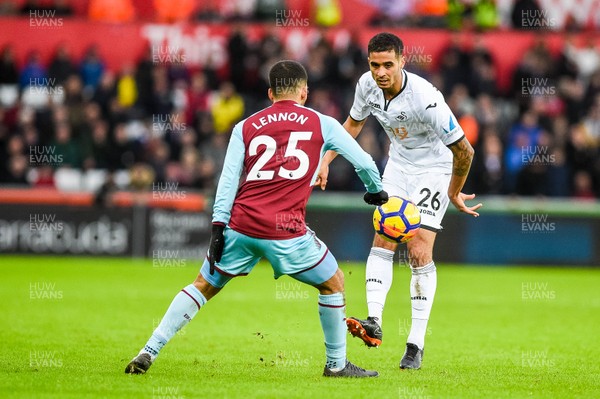 100218 - Swansea City v Burnley - Premier League - Kyle Naughton of Swansea City tries to take the ball past Aaron Lennon of Burnley 
