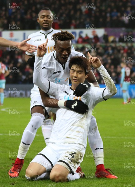 100218 - Swansea City v Burnley, Premier League - Ki Sung Yueng of Swansea City celebrates with Tammy Abraham of Swansea City after scoring goal