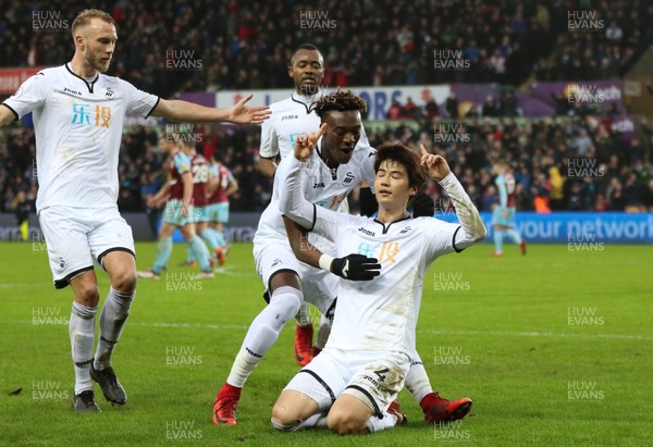100218 - Swansea City v Burnley, Premier League - Ki Sung Yueng of Swansea City celebrates with Tammy Abraham of Swansea City after scoring goal