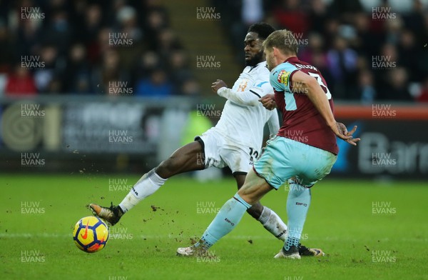 100218 - Swansea City v Burnley, Premier League - Nathan Dyer of Swansea City wins the ball from Charlie Taylor of Burnley