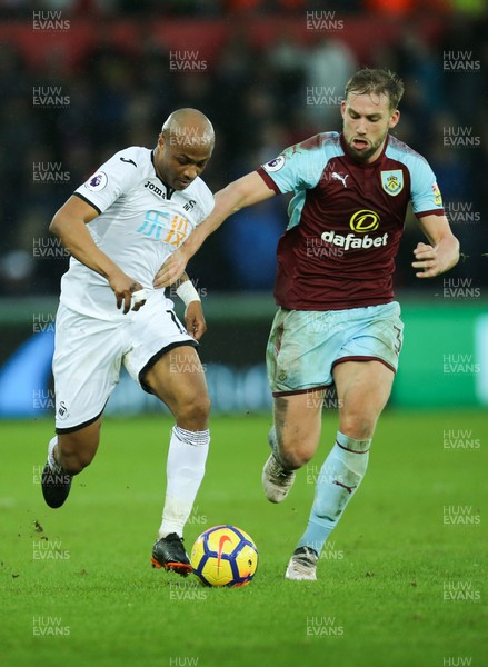 100218 - Swansea City v Burnley, Premier League - Andre Ayew of Swansea City is brought down by Charlie Taylor of Burnley