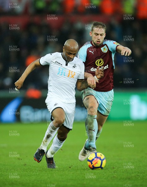 100218 - Swansea City v Burnley, Premier League - Andre Ayew of Swansea City is brought down by Charlie Taylor of Burnley