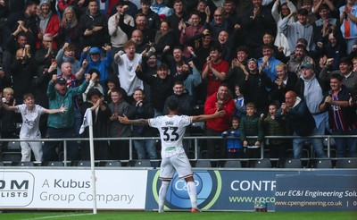 120926 Swansea City v Burnley, EFL Sky Bet Championship - Adam Idah of Swansea City celebrates in front of the fans after he scores the opening goal