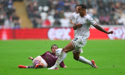 120926 Swansea City v Burnley, EFL Sky Bet Championship - Adam Idah of Swansea City takes on Connor Roberts of Burnley