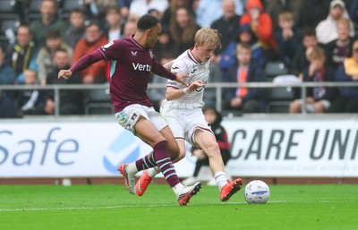 120926 Swansea City v Burnley, EFL Sky Bet Championship - Melker Widell of Swansea City takes on Aaron Ramsey of Burnley
