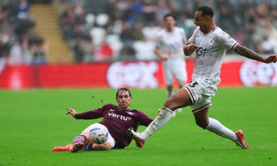 120926 Swansea City v Burnley, EFL Sky Bet Championship - Adam Idah of Swansea City takes on Connor Roberts of Burnley