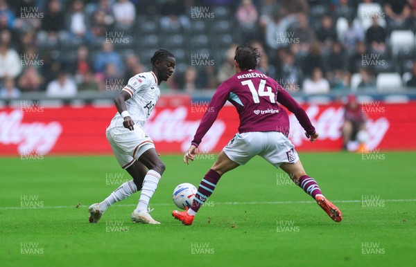 120926 Swansea City v Burnley, EFL Sky Bet Championship - Moussa Yeo of Swansea City and Connor Roberts of Burnley compete for the ball