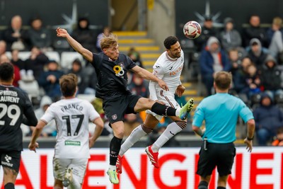 150325 - Swansea City v Burnley - Sky Bet Championship - Ben Cabango of Swansea City challenges for the aerial ball with Zian Flemming of Burnley