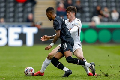 150325 - Swansea City v Burnley - Sky Bet Championship - Josh Key of Swansea City battles for the ball with Jaidon Anthony of Burnley