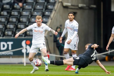 150325 - Swansea City v Burnley - Sky Bet Championship - Lewis O'Brien of Swansea City is tackled by Zian Flemming of Burnley