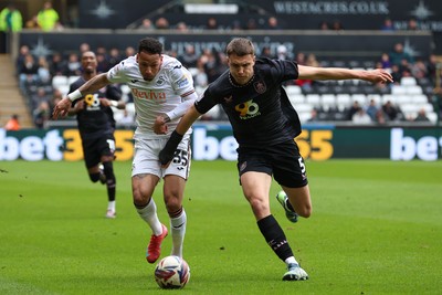 150325 - Swansea City v Burnley - Sky Bet Championship - Ronald of Swansea City battles for the ball with Maxime Estève of Burnley