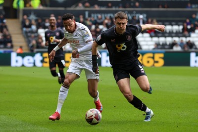 150325 - Swansea City v Burnley - Sky Bet Championship - Ronald of Swansea City battles for the ball with Maxime Estève of Burnley