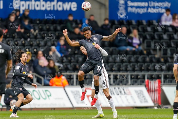 150325 - Swansea City v Burnley - Sky Bet Championship - Lyle Foster of Burnley challenges for the aerial ball with Jay Fulton of Swansea City