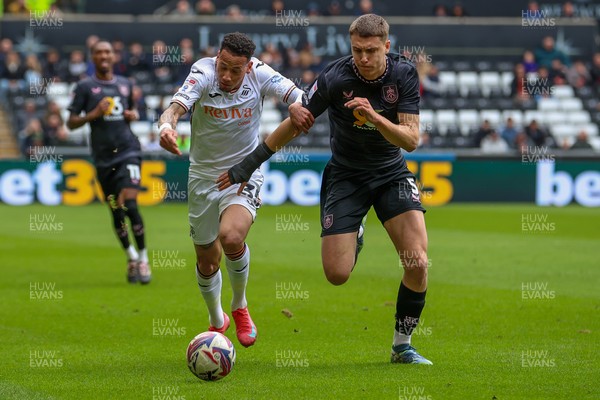 150325 - Swansea City v Burnley - Sky Bet Championship - Ronald of Swansea City battles for the ball with Maxime Estève of Burnley