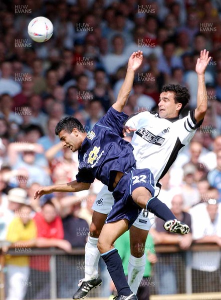 090803 - Swansea City v Bury - Third Division - Swansea's Roberto Martinez beats Harpal Singh to the ball