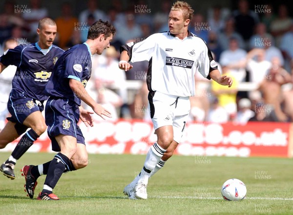 090803 - Swansea City v Bury - Third Division - Swansea's Lee Trundle considers his options as David Nugent closes him down